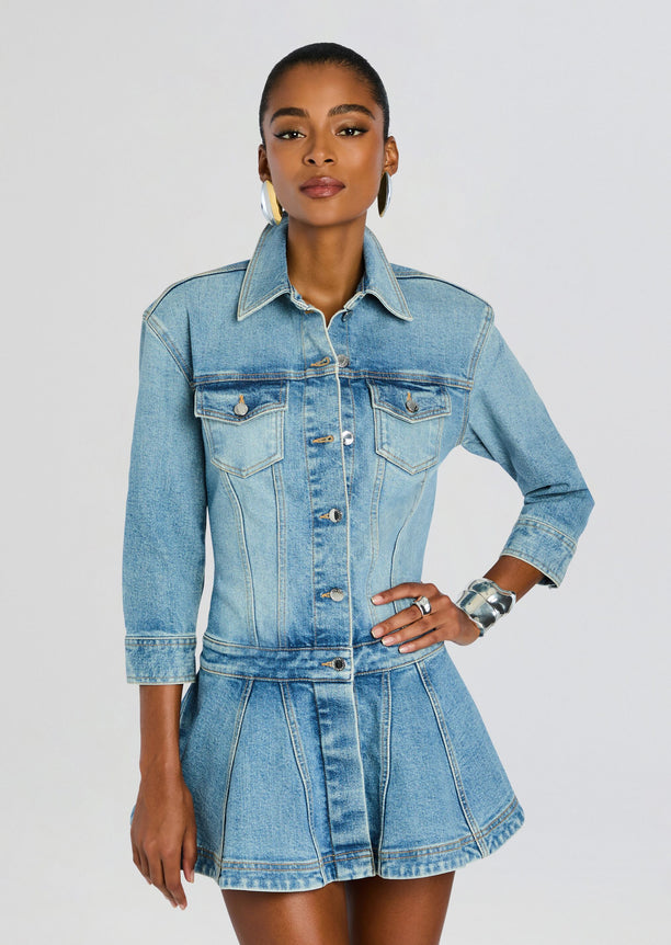 Aleyni Denim Dress worn by a model with collared neckline front buttons chest pockets and three-quarter sleeves.