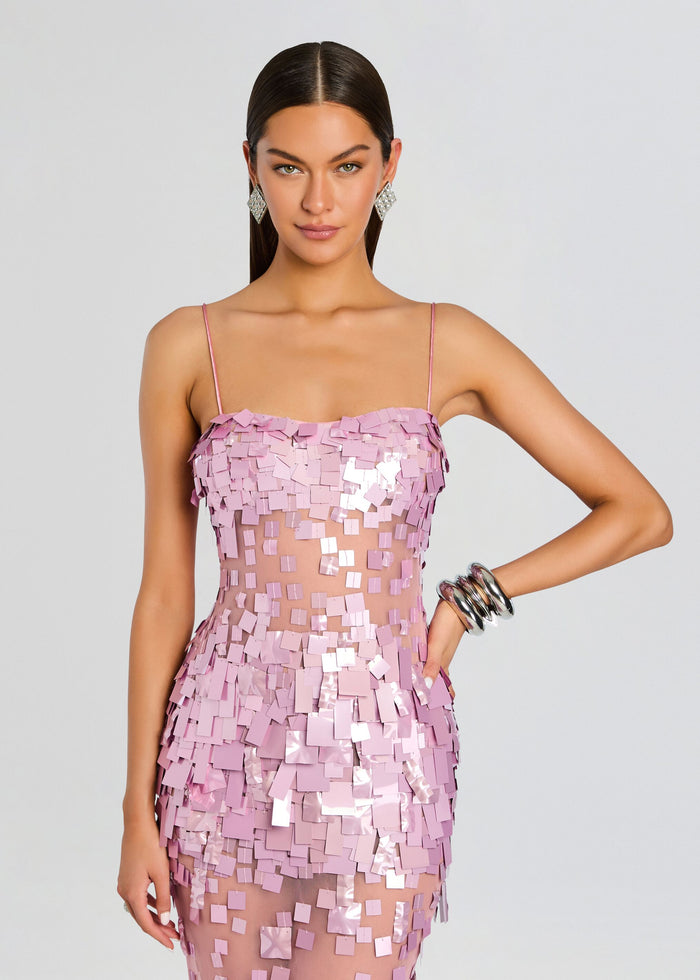 Model wearing Carmin Embellished Dress in pink with square sequins and a sheer midsection panel. media 5 of 5