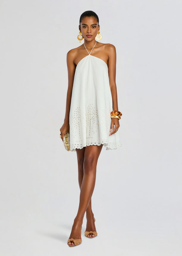 Model wearing pale blue Bagh Halter Mini Dress with eyelet hem and scalloped edge.