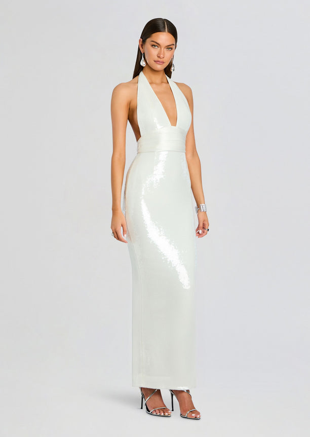 Full length view of the mint Kelsie Sequin Dress on model with halter neckline and sleek silhouette