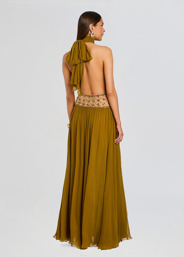 Back view of Kreeli Embellished Dress showing open back halter neck and intricately beaded waist with a long flowing skirt. media 4 of 5