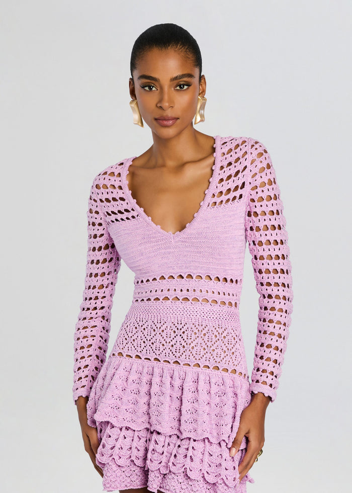 Model in lavender crochet dress with a deep V neckline and long sleeves. media 6 of 6
