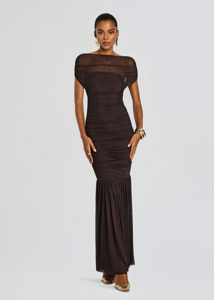 Full-length Noel Gown in dark brown with ruched bodice, sheer off‑the‑shoulder neckline, and a sheer hem panel. media 1 of 5