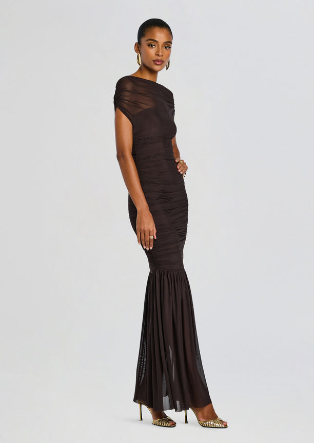Noel Gown in rich chocolate satin with ruching along the bodice and a sheer mermaid hem, paired with gold heels