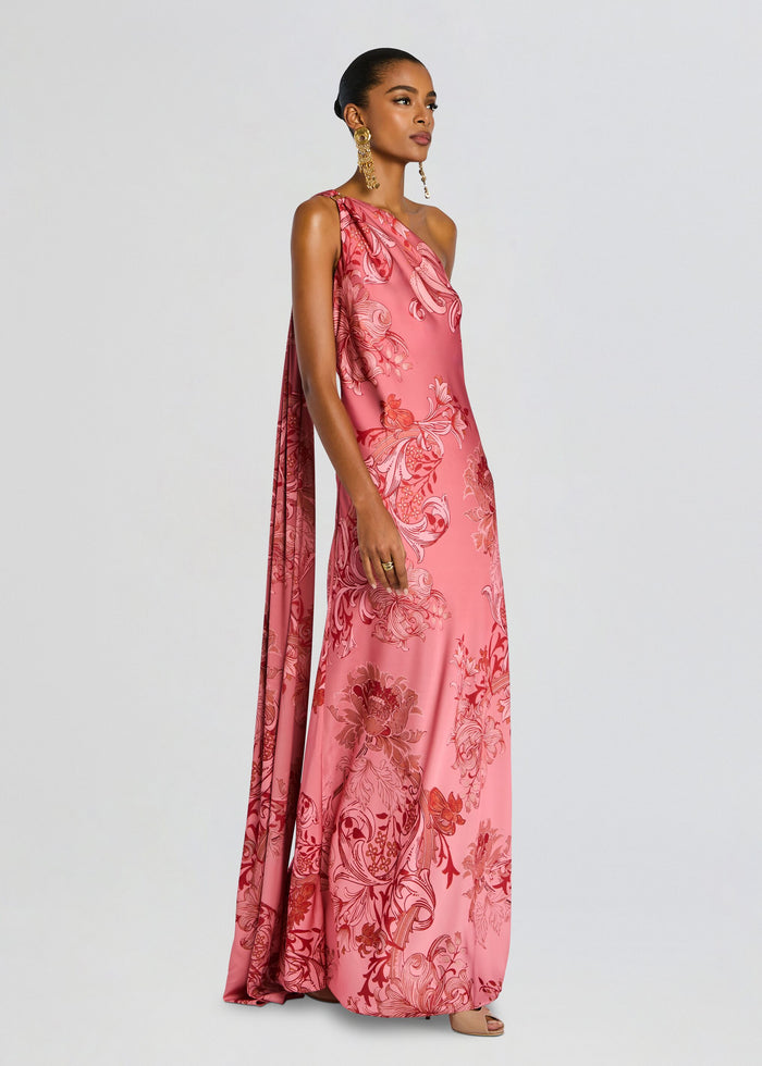 Side view of a model in a pink floral Vine One Shoulder Sash Dress showing the one shoulder silhouette and flowing sash media 4 of 5