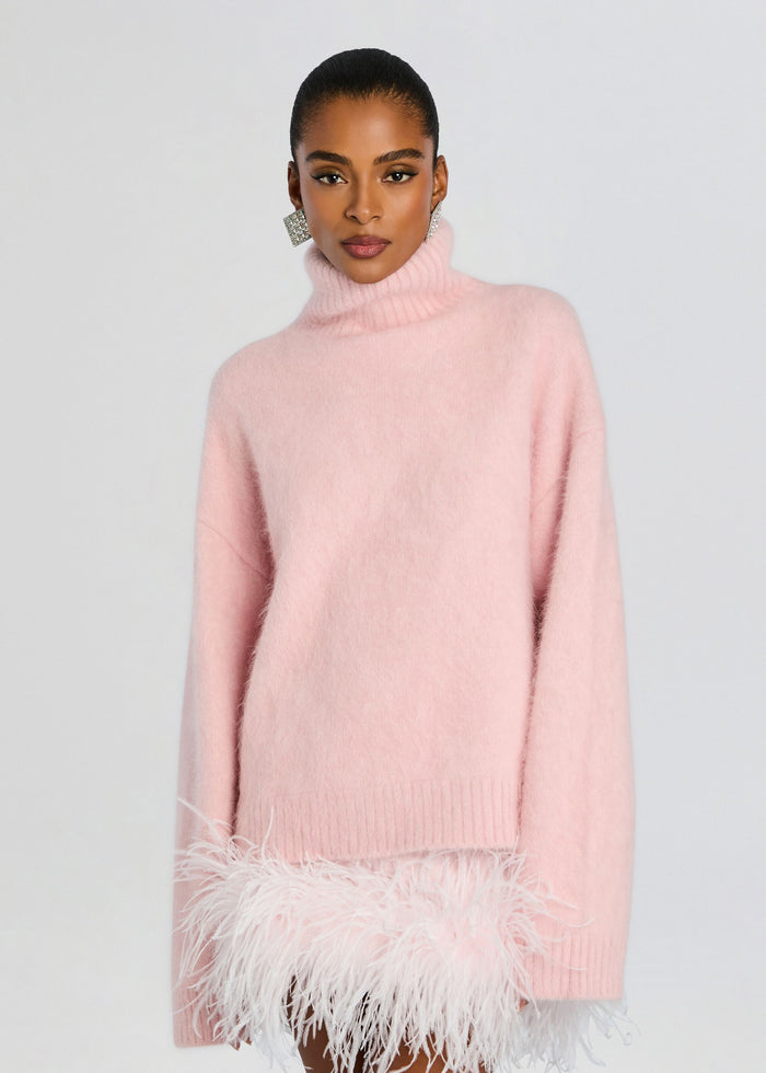 Oversized pink Olga Sweater with a chunky turtleneck and white feathered hem media 1 of 5