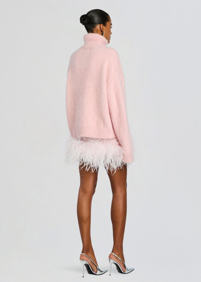 Back view of an oversized pale pink Olga Sweater with a chunky ribbed hem media 5 of 5