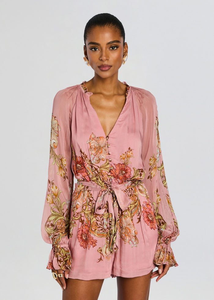 Front view of pink Sula romper with waist tie belt and bold floral print on the sleeves media 5 of 5
