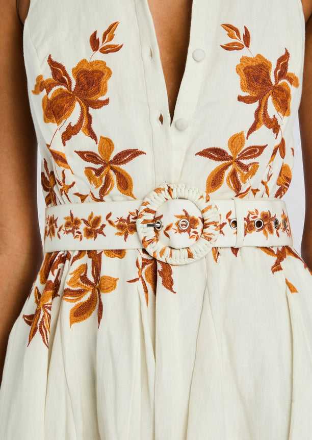 Cream Ayra Short Dress with round belt buckle and warm orange floral embroidery.