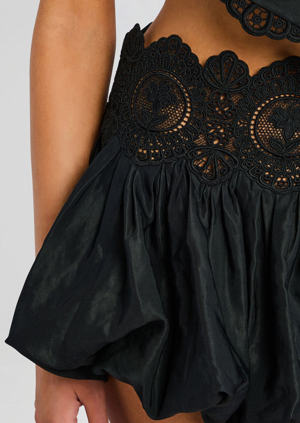 Close-up of the black floral lace waistband on the Leighton Skirt.