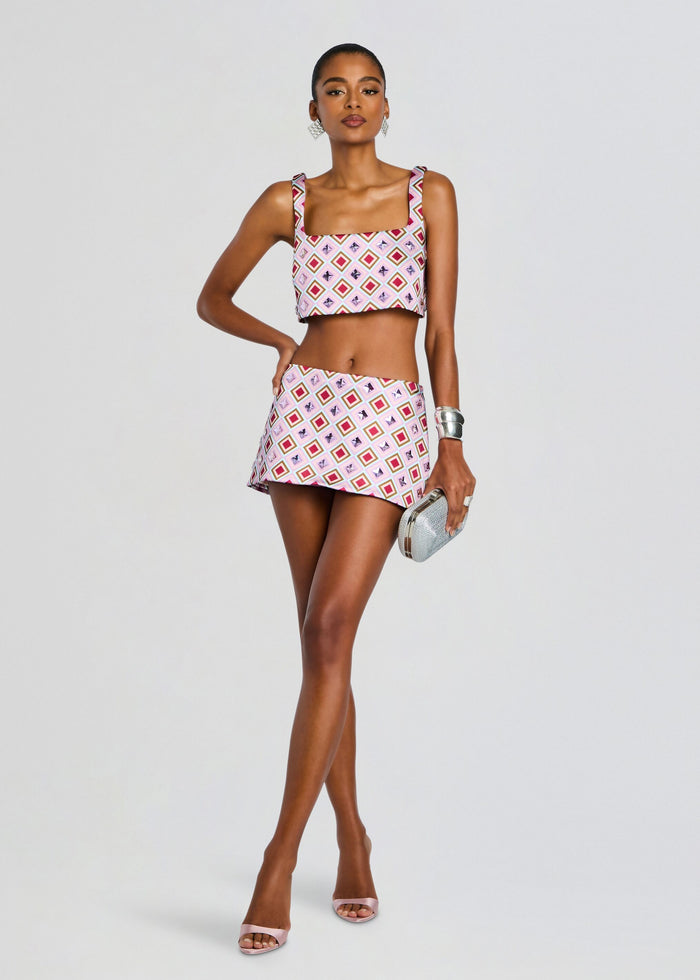 Front view of a model in the Ophelie Embellished Skort set with a pink diamond print crop top and matching mini skirt media 6 of 6