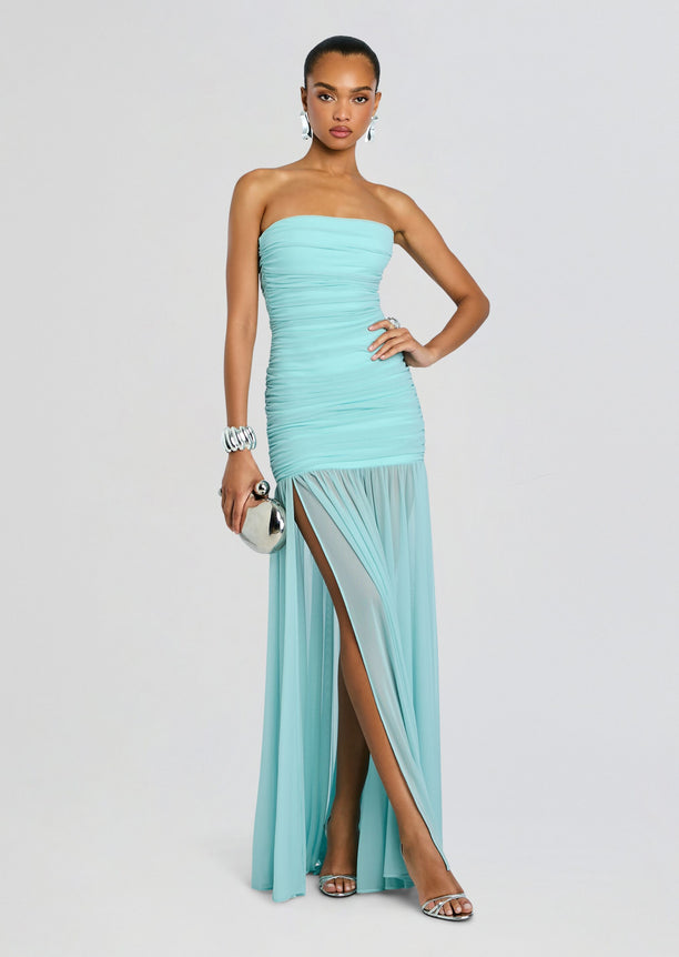 Turquoise strapless dress with ruched bodice and sheer tulle skirt with a high slit