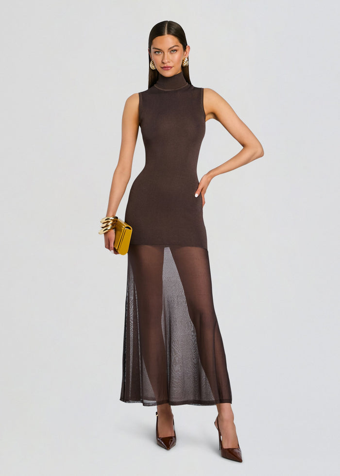 Front view of Amine Knit Maxi Dress in chocolate brown with a sleeveless turtleneck and sheer overlay skirt media 5 of 5