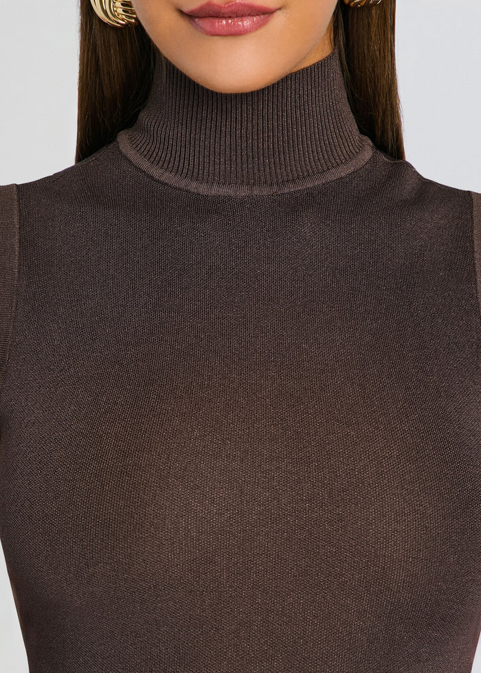 Close-up of the brown ribbed knit turtleneck fabric. media 2 of 5