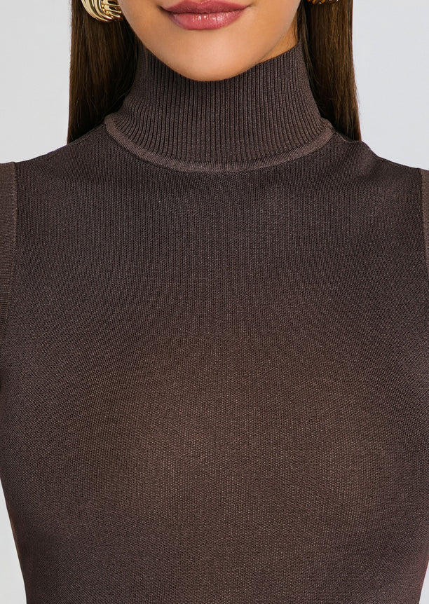 Close-up of the brown ribbed knit turtleneck fabric.