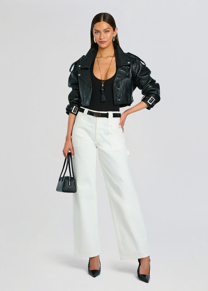 Angelique Denim Pant styled with a black belt and leather jacket on a model with a small black handbag and pointed heels media 2 of 5