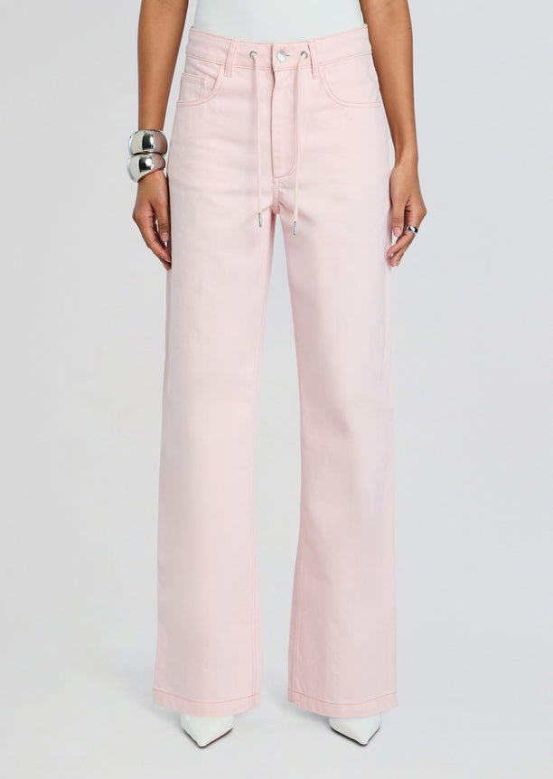 Pale pink high-waisted wide-leg denim pant with drawstring waist and front pockets