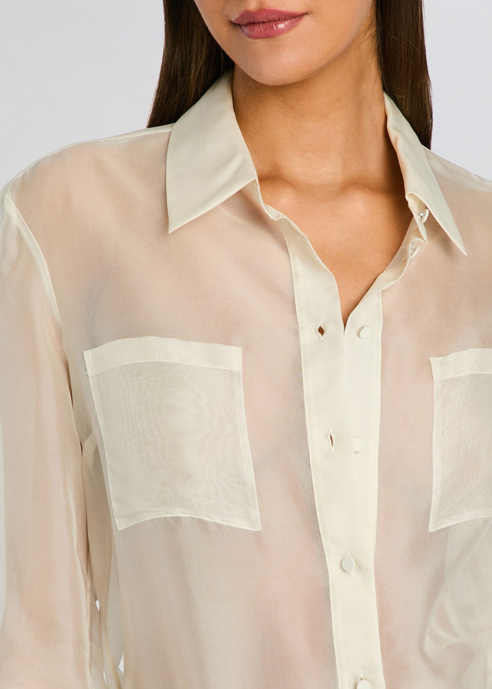 Close-up of sheer cream Estella Silk Top showing a pointed collar and two front pockets. media 3 of 5