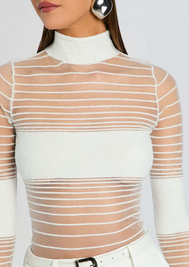 Close-up of Katrine Top showing sheer white striped knit with a solid white bust panel and a high neck