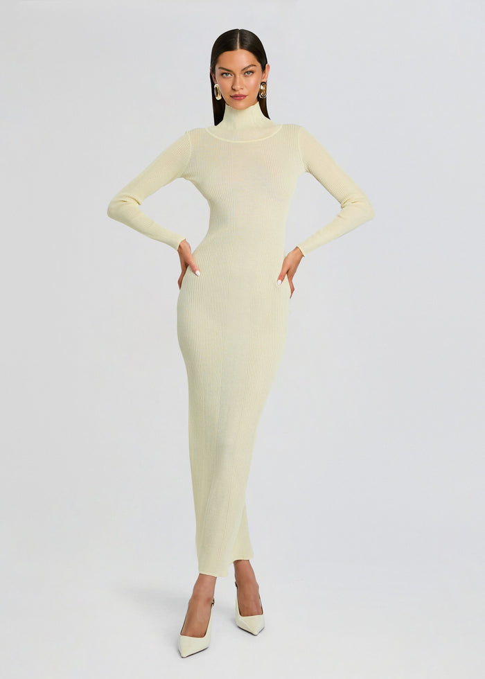 Full-length cream ribbed knit maxi dress with a high neck and long sleeves on a model. media 1 of 5