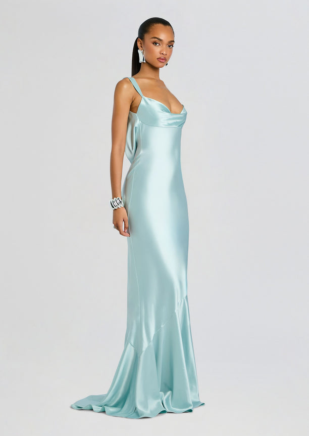 Vinicia Dress in icy mint satin with a draped neckline and flowing train worn by a model