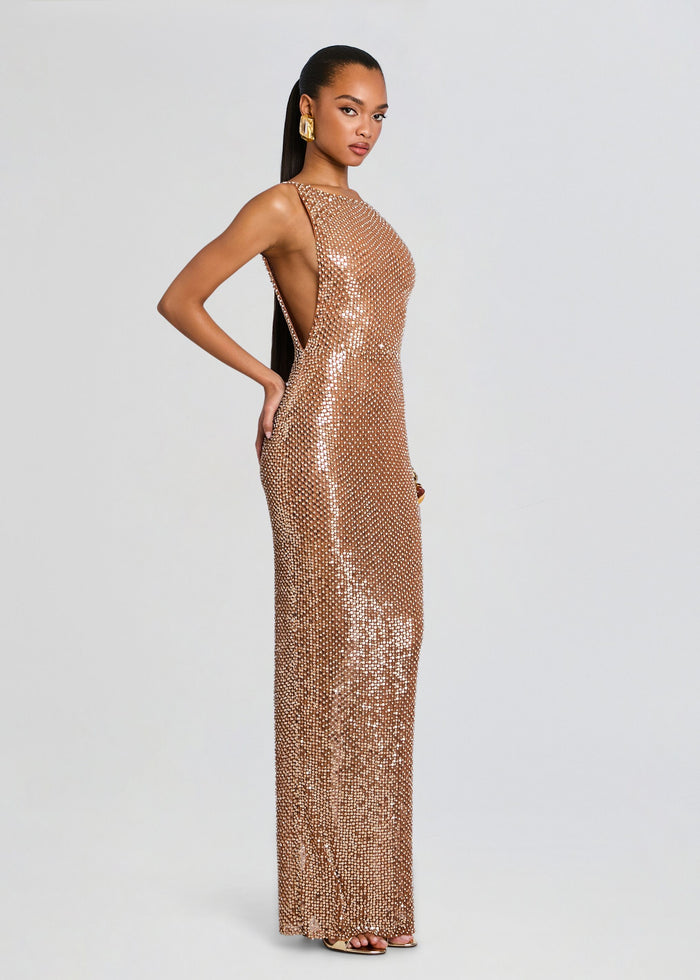 Side profile of model in Asha Sequin Dress highlighting the high side cutout and formfitting sequined gown media 4 of 5