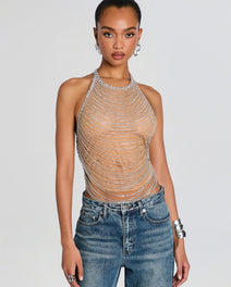 Model wearing a Delaney Embellished Top with cascading silver beaded chains over a nude base, paired with blue jeans.