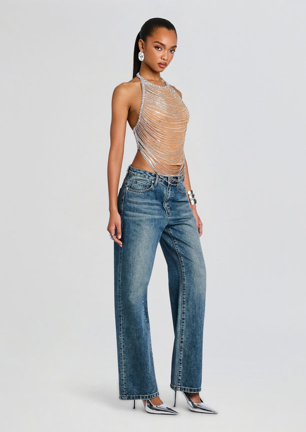 Delaney Embellished Top shown on a model with a multi strand silver chain halter and jeans.