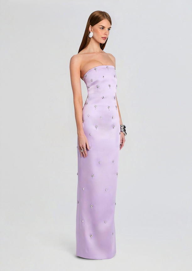 Model in full length lavender Keziah embellished dress shown from the side with scattered crystal motifs