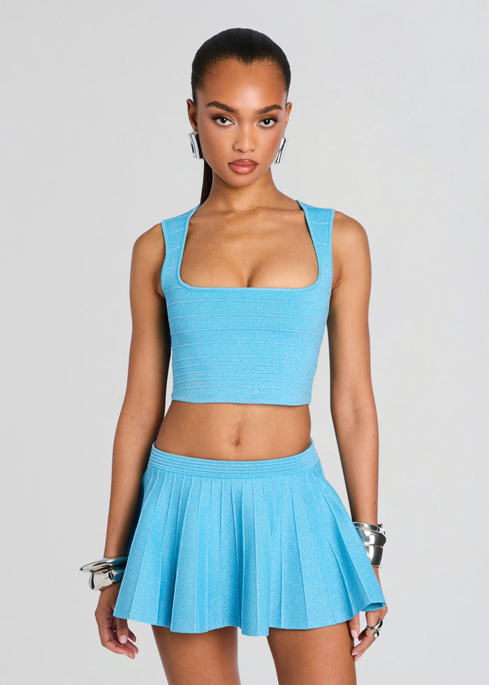 Amicie Bandage Knit Top in light blue with a square neckline paired with a matching pleated mini skirt on a model media 1 of 6