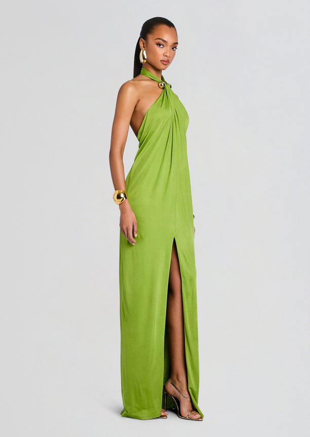 Full length lime green Becs Dress on a model with halter neck open back and thigh-high slit.