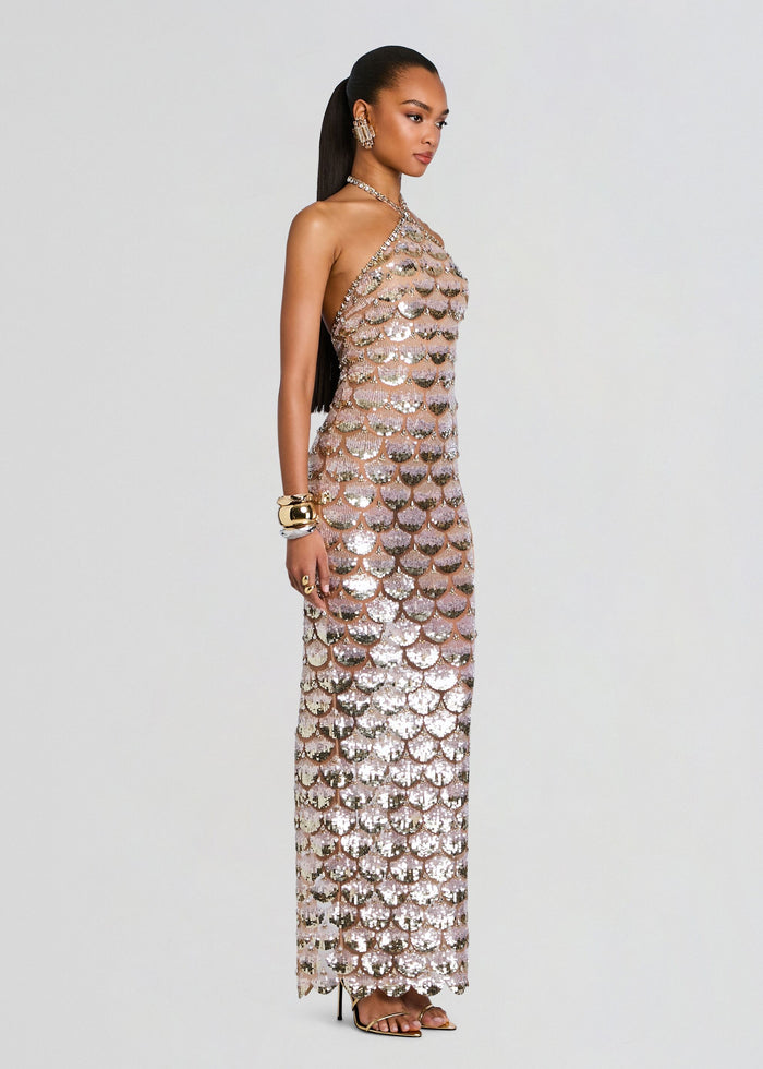 Side view of a model wearing the Genovia Embroidered Dress halter neck gown covered in pink and silver sequins. media 3 of 5