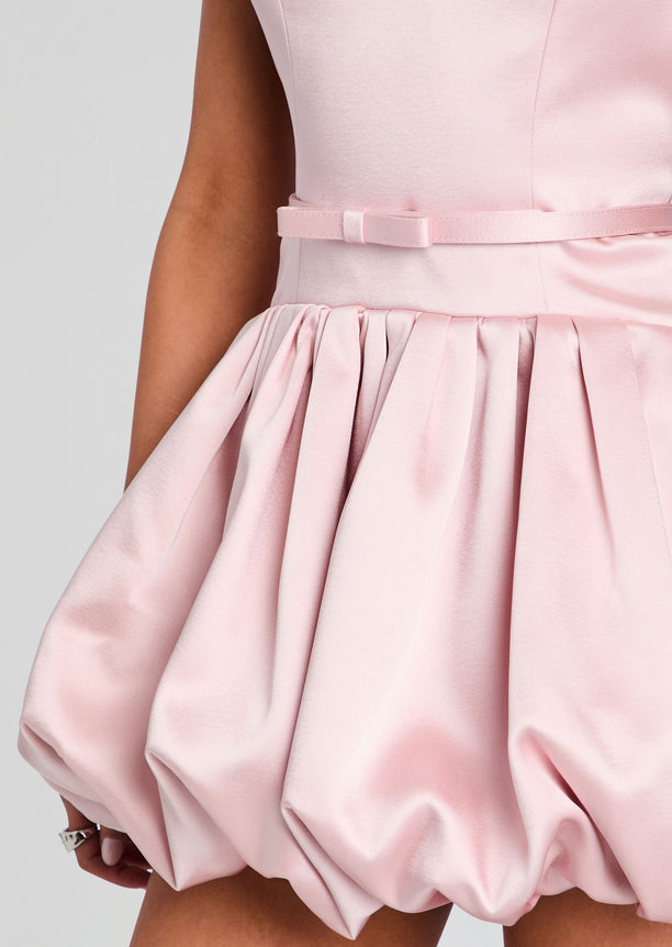 Close detail of pink satin Isolde Dress showing the waist belt and gathered bubble skirt.