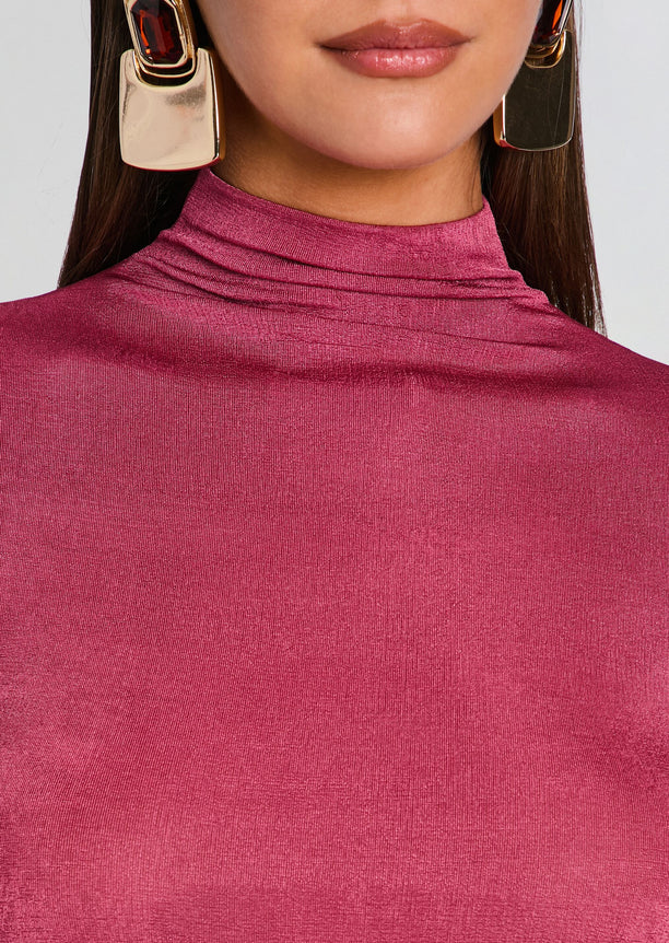 Close-up of magenta shimmer knit fabric at the Kim Maxi Dress neckline