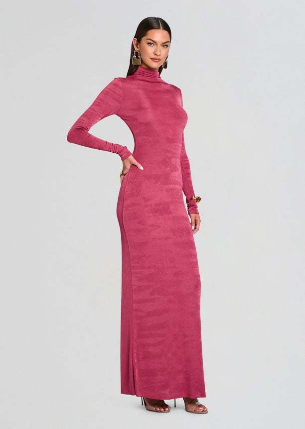 Full-length side view of a model wearing a magenta Kim Maxi Dress with long sleeves and high neckline