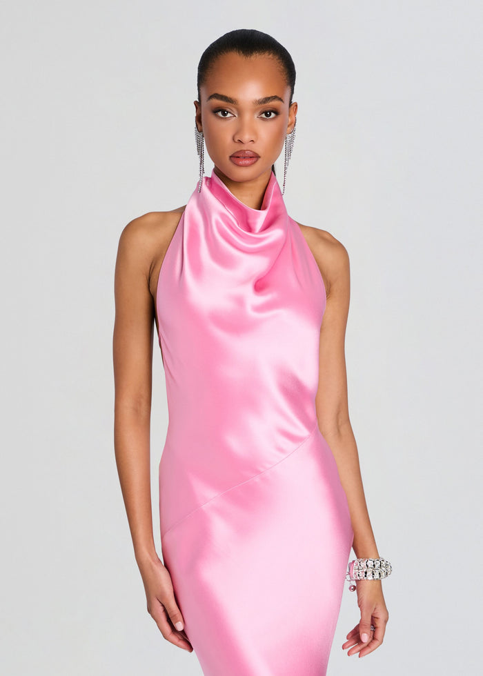Model wearing a pink satin Luneth Dress with a halter neckline. media 5 of 5