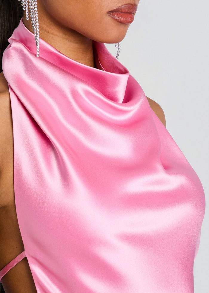 Close-up of a pink satin Luneth Dress with a draped cowl neckline and crystal earrings. media 2 of 5
