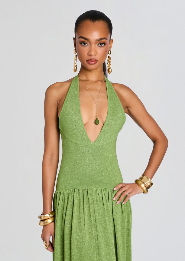 Front view of a lime green glitter knit dress with a deep plunging halter neckline and flowing floor-length skirt.