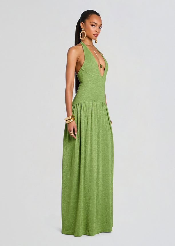 Marcelle Knit Dress shown on a model in a shimmering green halter neck maxi.