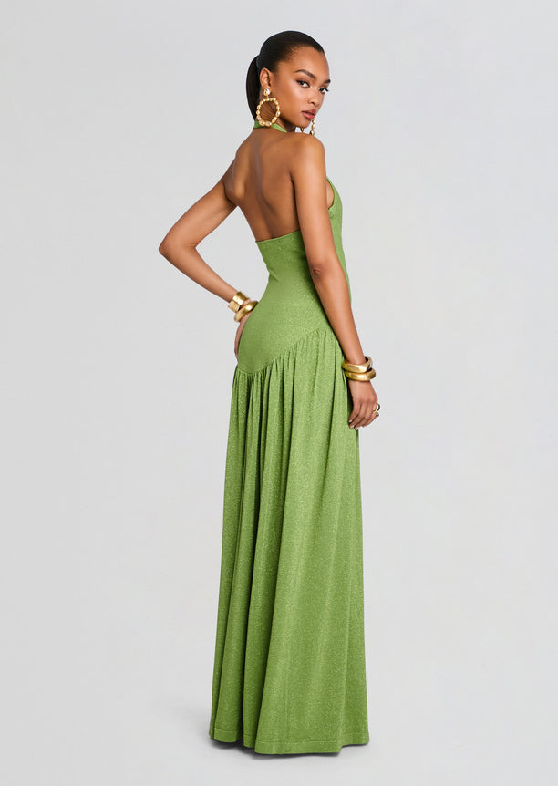 Back view of a lime green glitter knit dress with a halter neck and open back, full-length skirt.
