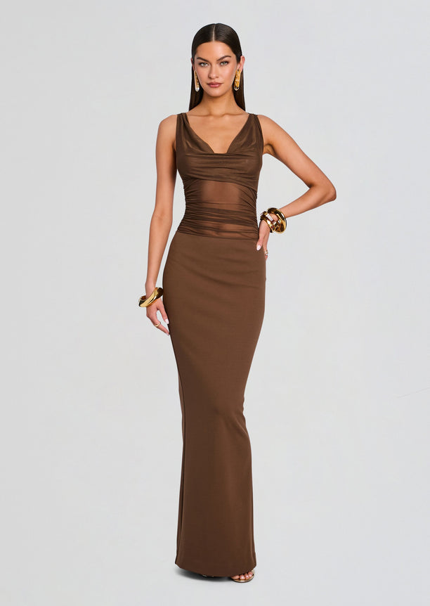 Model wearing Marla Maxi Dress in chocolate brown with a fitted silhouette and ruched bodice.
