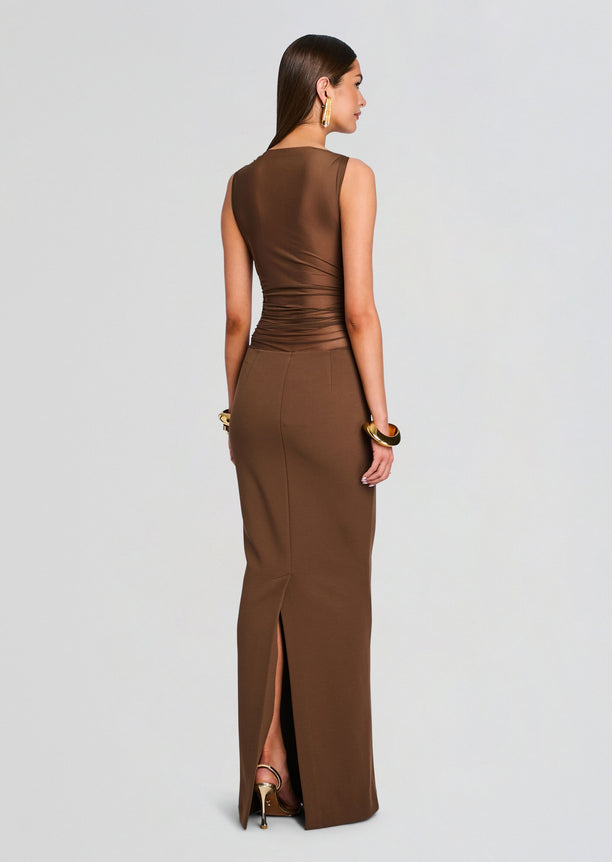 Back view of the bronze brown Marla Maxi Dress showing a fitted ruched bodice and back slit in the skirt.