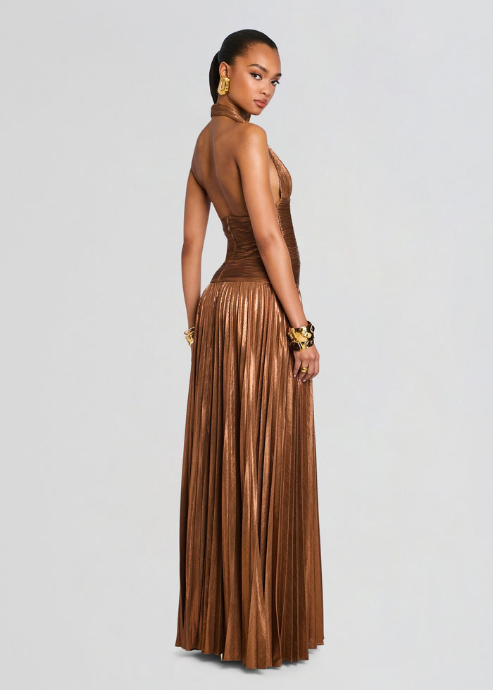Back view of a bronze metallic Orlina Dress with a ruched bodice and a full pleated floor-length skirt. media 5 of 6