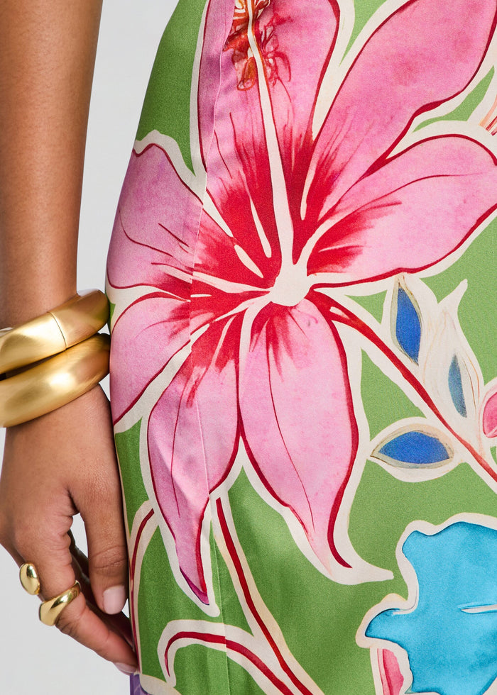 Close up of the Vivi Silk Dress print featuring a large pink flower on a green background media 3 of 6