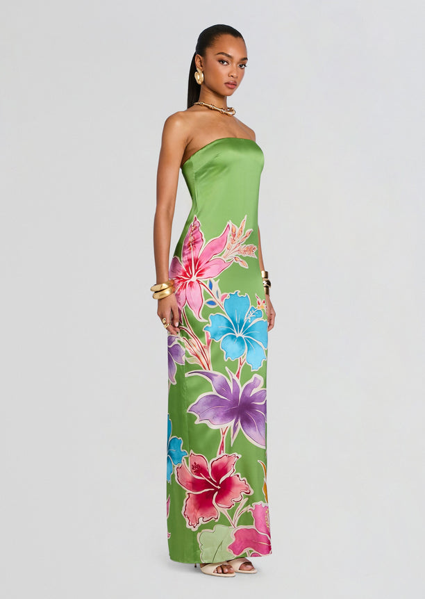 Full-length shot of Vivi Silk Dress on a model, strapless lime green gown with large colorful tropical flowers.