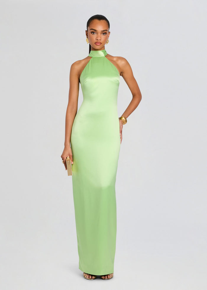 Full-length lime green satin halter neck dress on a model with gold jewelry and a small clutch media 1 of 5