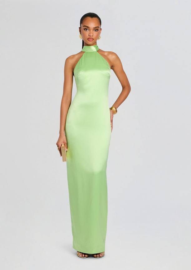 Full-length lime green satin halter neck dress on a model with gold jewelry and a small clutch