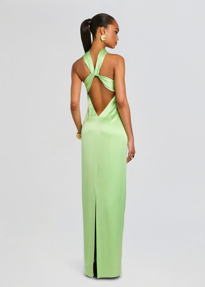 Back view of a lime green satin gown with a halter neckline and crisscross back straps forming a large open back. media 4 of 5
