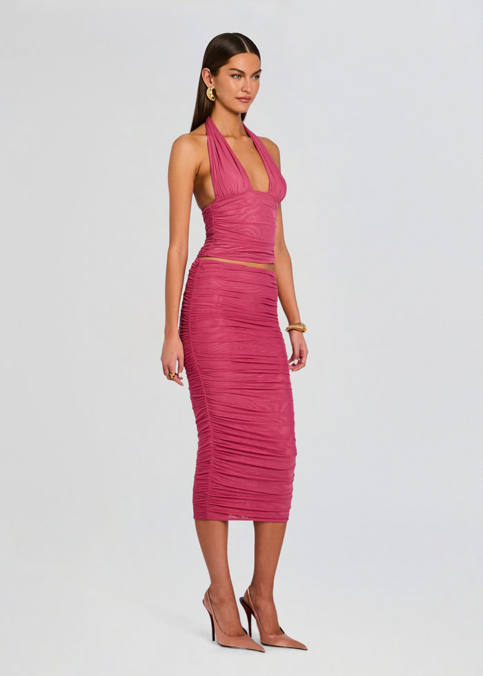 Full-body view of a model in pink Bimini Mesh Halter Top with ruched midi skirt and nude heels. media 4 of 5