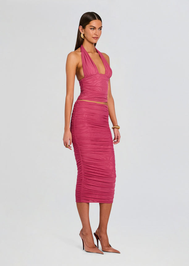 Front view of a model in a pink halter top and ruched Pia Mesh Midi Skirt
